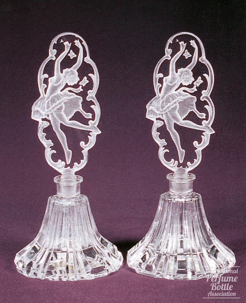 Pair of Bottles With Leaping Ballerina Stoppers