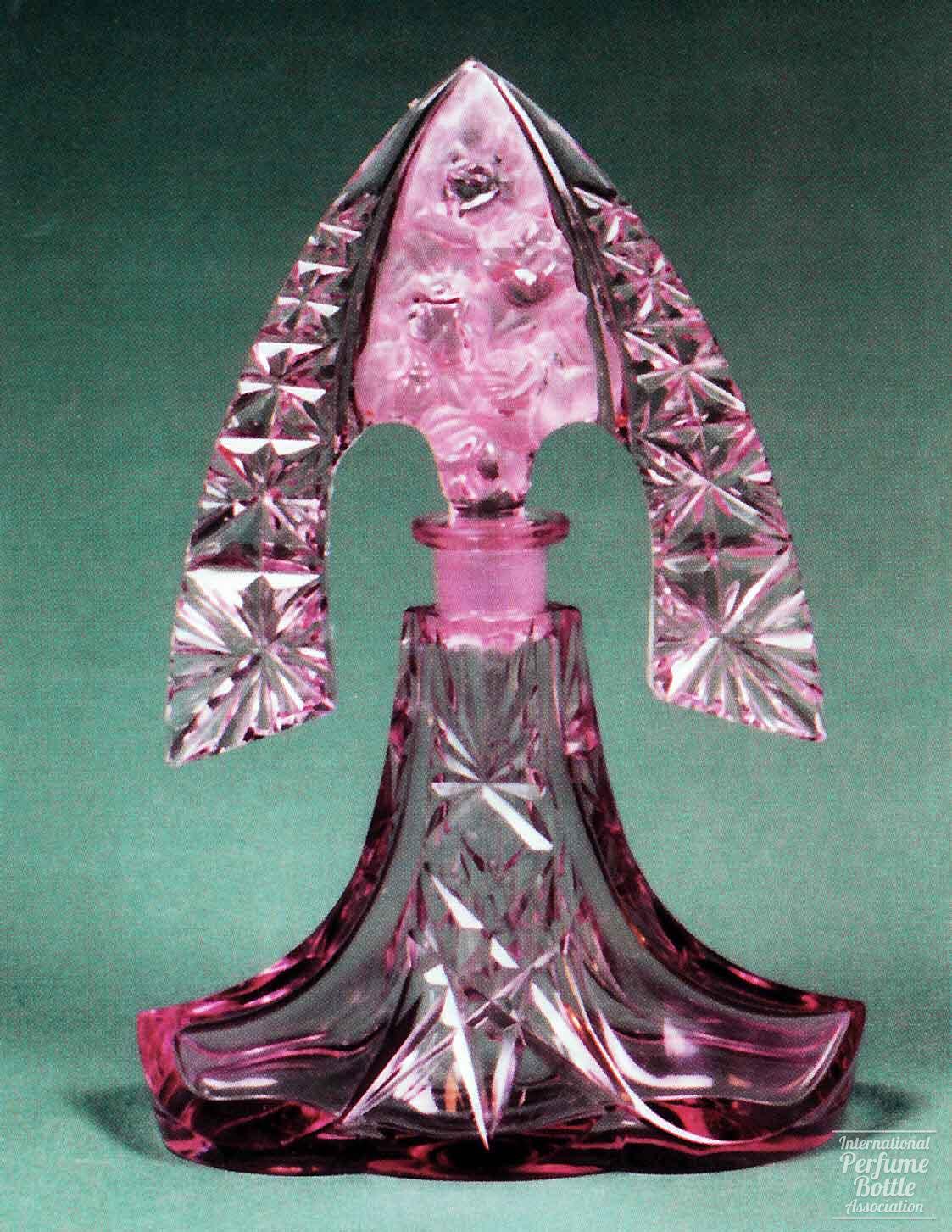 Rose Colored Bottle With Tiara Stopper