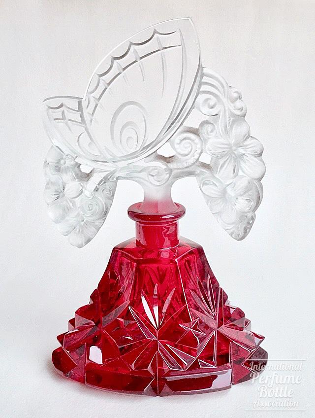 Red and Clear Bottle With Butterfly Stopper