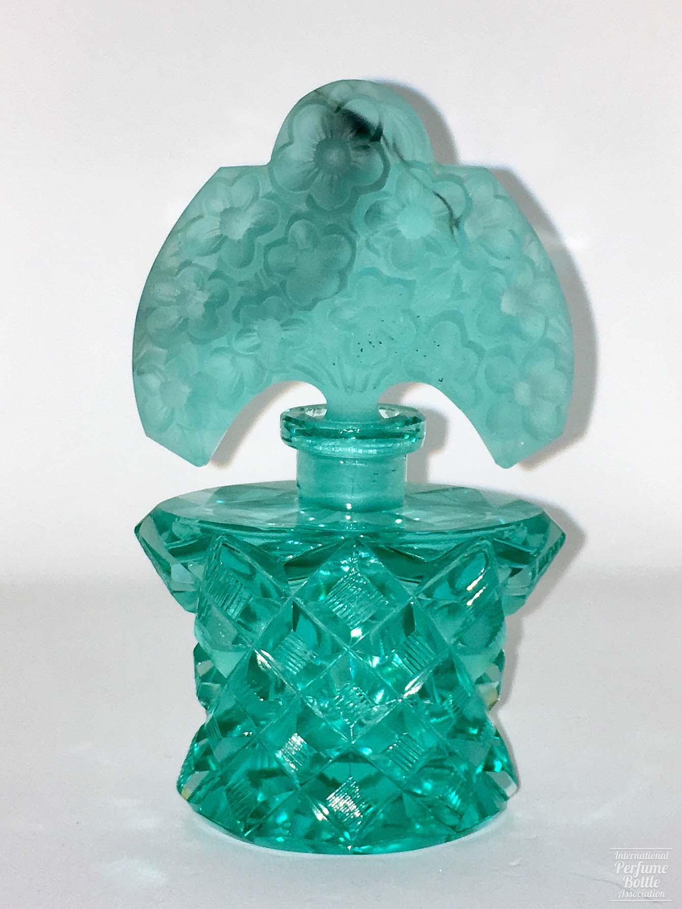 Turquoise Bottle With Floral Stopper